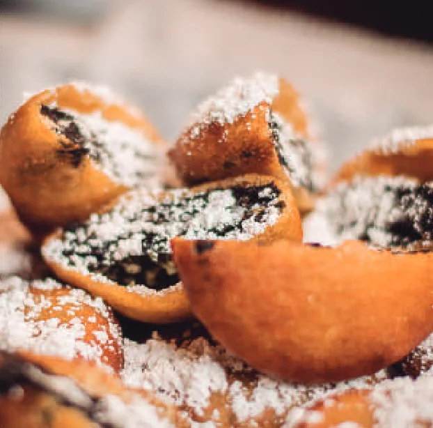 Fried Oreos dusted with powdered sugar