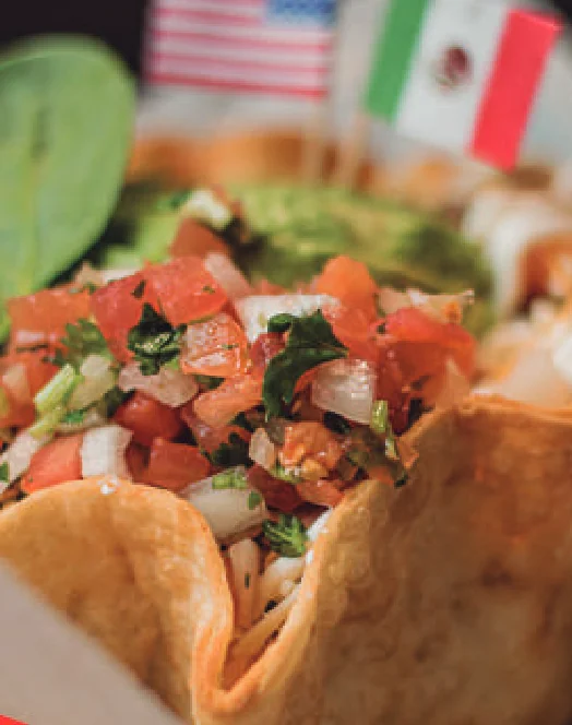 Taco salad in a tortilla bowl with pico de gallo